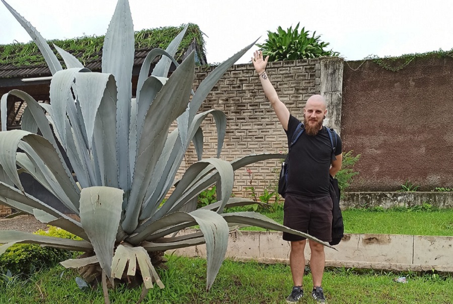 David with a huge Cactus in front of DAPP Zambia's entrance