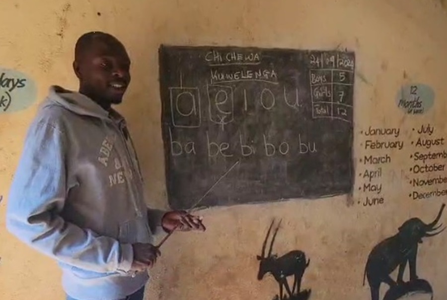 Preschool Teacher teaching the alphabet